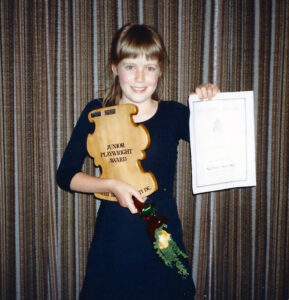 Me with my award for a play about my disaster zone of a childhood bedroom.